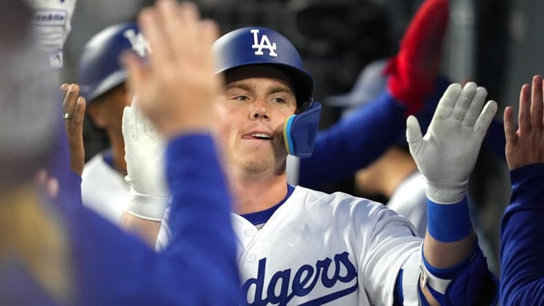 Apr 4, 2023; Los Angeles, California, USA; Los Angeles Dodgers catcher Will Smith (16) celebrates with teammates after hitting a two-run home run in the first inning against the Colorado Rockies at Dodger Stadium. Mandatory Credit: Kirby Lee-USA TODAY Sports