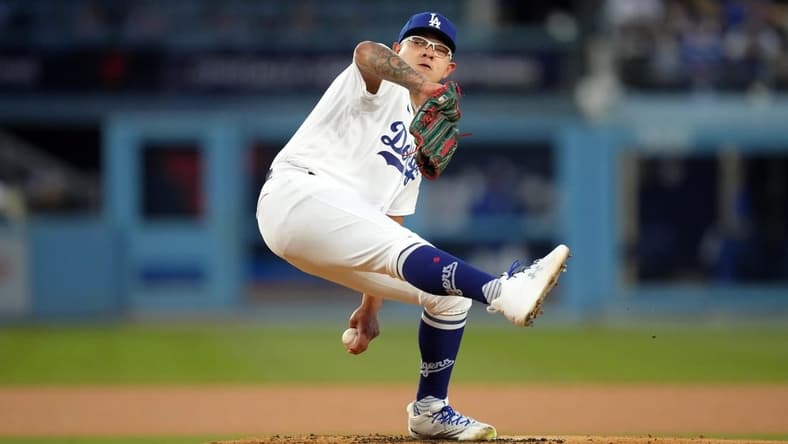Apr 4, 2023; Los Angeles, California, USA; Los Angeles Dodgers starting pitcher Julio Urias (7) throws in the first inning against the Colorado Rockies at Dodger Stadium. Mandatory Credit: Kirby Lee-USA TODAY Sports