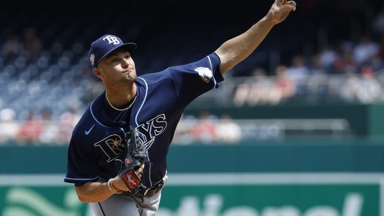 Apr 5, 2023; Washington, District of Columbia, USA; Tampa Bay Rays starting pitcher Shane McClanahan (18) pitches against the Washington Nationals during the first inning at Nationals Park. Mandatory Credit: Geoff Burke-USA TODAY Sports