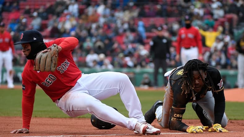 Apr 5, 2023; Boston, Massachusetts, USA; Pittsburgh Pirates shortstop Oneil Cruz (15) and Boston Red Sox third baseman Rafael Devers (11) collide at third base during the seventh inning at Fenway Park. Mandatory Credit: Eric Canha-USA TODAY Sports