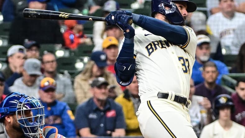 Apr 5, 2023; Milwaukee, Wisconsin, USA; Milwaukee Brewers designated hitter Jesse Winker (33) hits a double to drive in two runs in the fifth inning against the New York Mets at American Family Field. Mandatory Credit: Benny Sieu-USA TODAY Sports