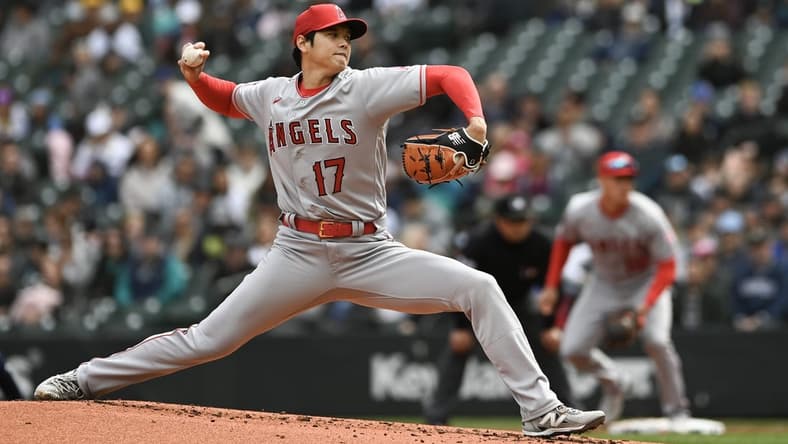 Apr 5, 2023; Seattle, Washington, USA; Los Angeles Angels starting pitcher Shohei Ohtani (17) throws a pitch against the Seattle Mariners during the first inning at T-Mobile Park. Mandatory Credit: Michael Thomas Shroyer-USA TODAY Sports