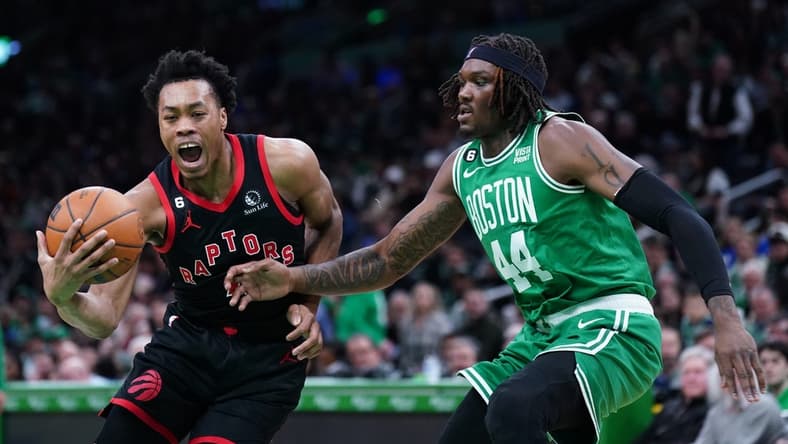 Apr 5, 2023; Boston, Massachusetts, USA; Toronto Raptors forward Scottie Barnes (4) drives the ball against Boston Celtics center Robert Williams III (44) in the second quarter at TD Garden. Mandatory Credit: David Butler II-USA TODAY Sports