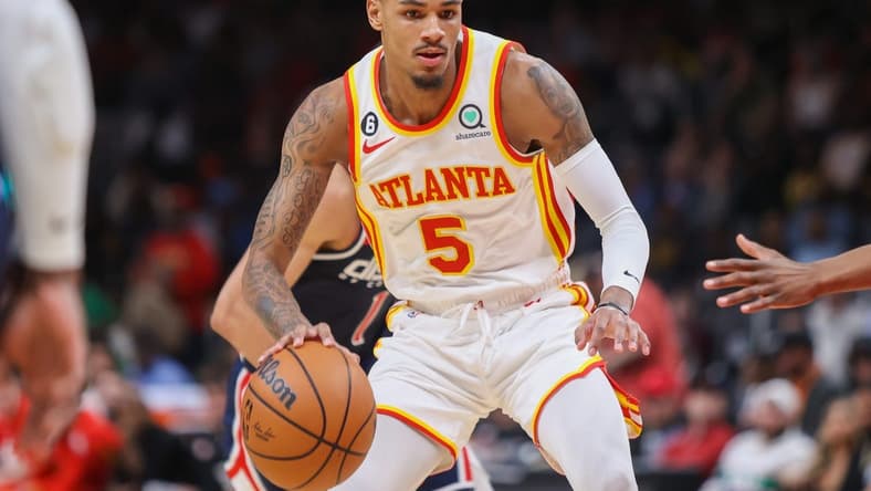 Apr 5, 2023; Atlanta, Georgia, USA; Atlanta Hawks guard Dejounte Murray (5) dribbles against the Washington Wizards in the first half at State Farm Arena. Mandatory Credit: Brett Davis-USA TODAY Sports
