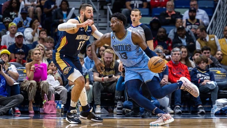 Apr 5, 2023; New Orleans, Louisiana, USA;  Memphis Grizzlies forward Jaren Jackson Jr. (13) dribbles against New Orleans Pelicans center Jonas Valanciunas (17) during the first half at Smoothie King Center. Mandatory Credit: Stephen Lew-USA TODAY Sports