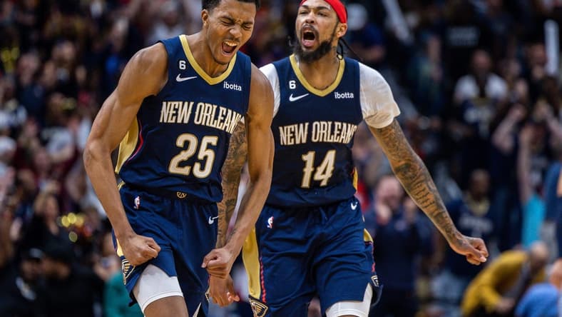 Apr 5, 2023; New Orleans, Louisiana, USA;  New Orleans Pelicans guard Trey Murphy III (25) reacts to making a three point basket with forward Brandon Ingram (14) against the Memphis Grizzlies during the second half at Smoothie King Center. Mandatory Credit: Stephen Lew-USA TODAY Sports