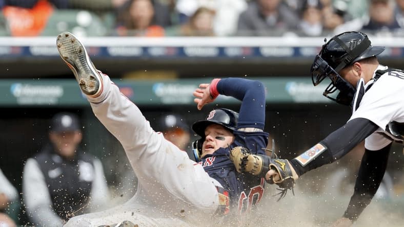 Apr 6, 2023; Detroit, Michigan, USA; Boston Red Sox right fielder Alex Verdugo (99) slides in safe at home ahead of the tag by Detroit Tigers catcher Jake Rogers (34) in the sixth inning at Comerica Park. Mandatory Credit: Rick Osentoski-USA TODAY Sports