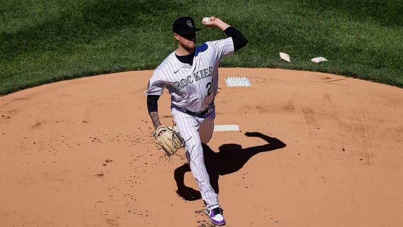 Apr 6, 2023; Denver, Colorado, USA; Colorado Rockies starting pitcher Kyle Freeland (21) delivers a pitch in the first inning against the Washington Nationals at Coors Field. Mandatory Credit: Isaiah J. Downing-USA TODAY Sports