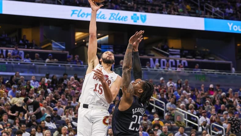 Apr 6, 2023; Orlando, Florida, USA; Cleveland Cavaliers forward Isaiah Mobley (15) shoots the ball over Orlando Magic forward Admiral Schofield (25) during the second quarter at Amway Center. Mandatory Credit: Mike Watters-USA TODAY Sports