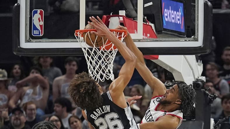 Apr 6, 2023; Austin, Texas, USA; Portland Trailblazers forward Trendon Watford (2) dunks over San Antonio Spurs forward Dominick Barlow (26) during the first half at Moody Center. Mandatory Credit: Scott Wachter-USA TODAY Sports