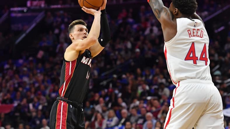 Apr 6, 2023; Philadelphia, Pennsylvania, USA; Miami Heat guard Tyler Herro (14) shoots over Philadelphia 76ers forward Paul Reed (44) during the first quarter at Wells Fargo Center. Mandatory Credit: Eric Hartline-USA TODAY Sports