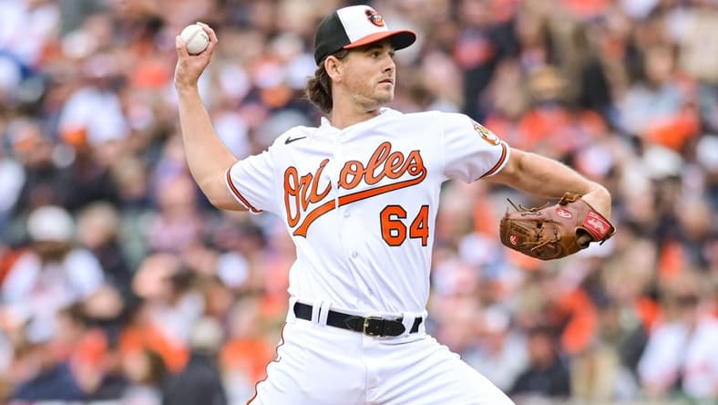 Apr 7, 2023; Baltimore, Maryland, USA;  Baltimore Orioles starting pitcher Dean Kremer (64) delivers a first inning pitch against the New York Yankees at Oriole Park at Camden Yards. Mandatory Credit: Tommy Gilligan-USA TODAY Sports