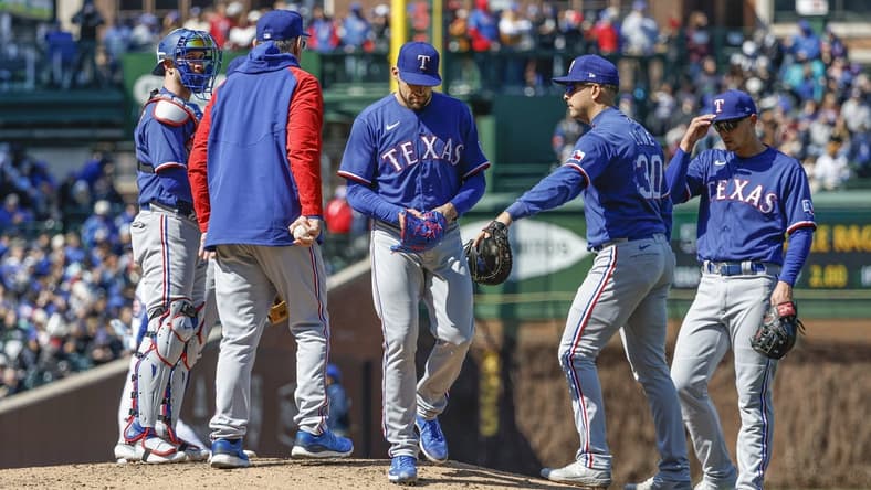 Apr 7, 2023; Chicago, Illinois, USA; Texas Rangers starting pitcher Nathan Eovaldi (17) leaves a baseball game against the Chicago Cubs during the sixth inning at Wrigley Field. Mandatory Credit: Kamil Krzaczynski-USA TODAY Sports