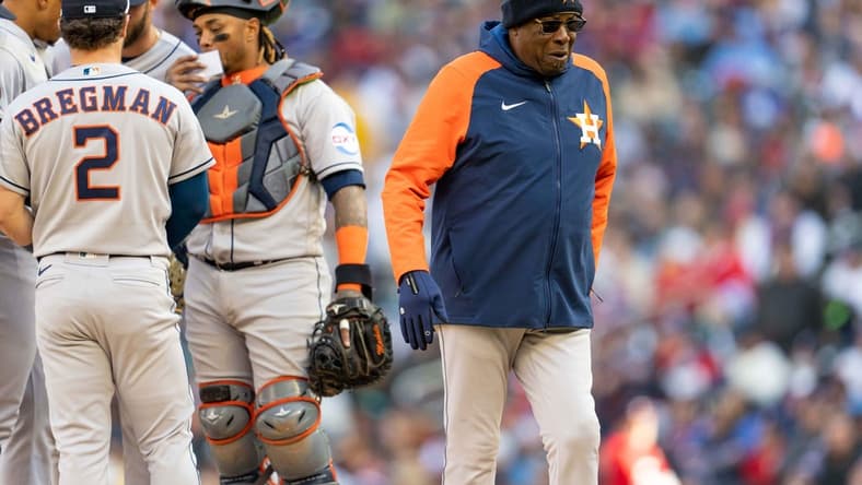 Apr 7, 2023; Minneapolis, Minnesota, USA; Houston Astros manager Dusty Baker Jr. (12) walks back to the dugout after handing Houston Astros relief pitcher Bryan Abreu (52) the ball in the sixth inning at Target Field. Mandatory Credit: Matt Blewett-USA TODAY Sports