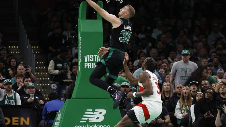 Apr 7, 2023; Boston, Massachusetts, USA; Boston Celtics forward Sam Hauser (30) goes past Toronto Raptors forward O.G. Anunoby (3) for a basket during the first quarter at TD Garden. Mandatory Credit: Winslow Townson-USA TODAY Sports
