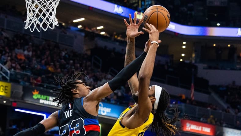 Apr 7, 2023; Indianapolis, Indiana, USA; Indiana Pacers forward Isaiah Jackson (22) shoots the ball while  Detroit Pistons guard Jaden Ivey (23) defends in the first half at Gainbridge Fieldhouse. Mandatory Credit: Trevor Ruszkowski-USA TODAY Sports