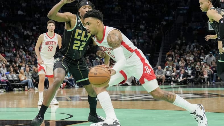 Apr 7, 2023; Charlotte, North Carolina, USA;Houston Rockets forward Kenyon Martin Jr. (6) drives to the basket against Charlotte Hornets forward Xavier Sneed (22) during the second quarter at the Spectrum Center. Mandatory Credit: Jim Dedmon-USA TODAY Sports