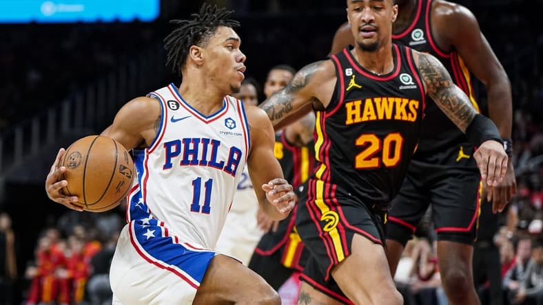 Apr 7, 2023; Atlanta, Georgia, USA; Philadelphia 76ers guard Jaden Springer (11) drives to the basket against Atlanta Hawks forward John Collins (20) during the first half at State Farm Arena. Mandatory Credit: Dale Zanine-USA TODAY Sports