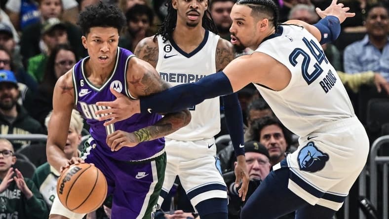 Apr 7, 2023; Milwaukee, Wisconsin, USA; Milwaukee Bucks guard Marjon Beauchamp (0) gets pressure from Memphis Grizzlies guard Dillon Brooks (24) in the first quarter at Fiserv Forum. Mandatory Credit: Benny Sieu-USA TODAY Sports