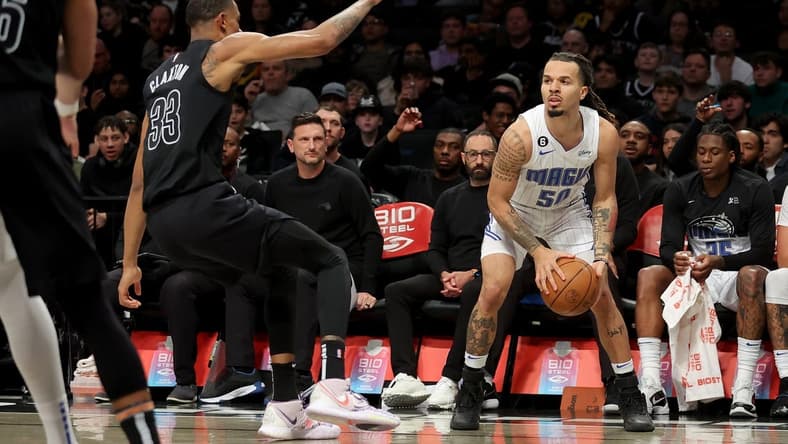 Apr 7, 2023; Brooklyn, New York, USA; Orlando Magic guard Cole Anthony (50) looks to shoot the ball against Brooklyn Nets center Nic Claxton (33) during the second quarter at Barclays Center. Mandatory Credit: Brad Penner-USA TODAY Sports