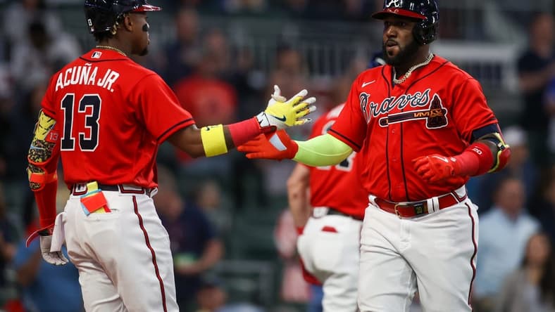 Apr 7, 2023; Atlanta, Georgia, USA; Atlanta Braves left fielder Marcell Ozuna (20) celebrates after a home run with right fielder Ronald Acuna Jr. (13) against the San Diego Padres in the third inning at Truist Park. Mandatory Credit: Brett Davis-USA TODAY Sports