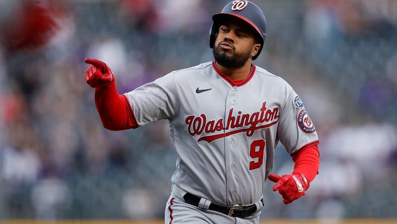 Apr 7, 2023; Denver, Colorado, USA; Washington Nationals third baseman Jeimer Candelario (9) gestures as he rounds the bases on a solo home run in the first inning against the Colorado Rockies at Coors Field. Mandatory Credit: Isaiah J. Downing-USA TODAY Sports