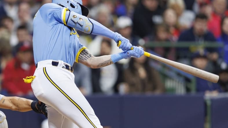 Apr 7, 2023; Milwaukee, Wisconsin, USA;  Milwaukee Brewers center fielder Garrett Mitchell (5) this an RBI single during the third inning against the St. Louis Cardinals at American Family Field. Mandatory Credit: Jeff Hanisch-USA TODAY Sports