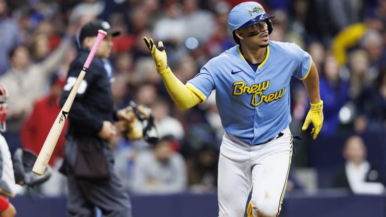 Apr 7, 2023; Milwaukee, Wisconsin, USA;  Milwaukee Brewers shortstop Willy Adames (27) tosses hit bat away after hitting a home run during the seventh inning against the St. Louis Cardinals at American Family Field. Mandatory Credit: Jeff Hanisch-USA TODAY Sports