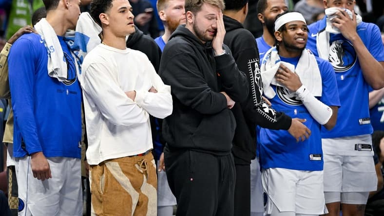 Apr 7, 2023; Dallas, Texas, USA; Dallas Mavericks guard Josh Green (8) and guard Luka Doncic (77) and forward Reggie Bullock (25) and forward Markieff Morris (13) and center JaVale McGee (00) watch the game between the Dallas Mavericks and the Chicago Bulls during the second half at the American Airlines Center. Mandatory Credit: Jerome Miron-USA TODAY Sports