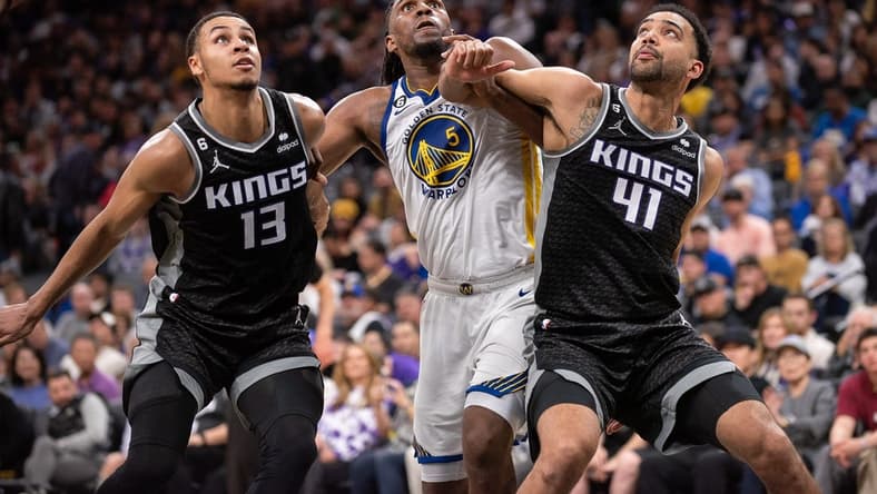 Apr 7, 2023; Sacramento, California, USA; Sacramento Kings forward Keegan Murray (13) and forward Trey Lyles (41) fight for position under the basket with Golden State Warriors forward Kevon Looney (5) during the third quarter at Golden 1 Center. Mandatory Credit: Ed Szczepanski-USA TODAY Sports