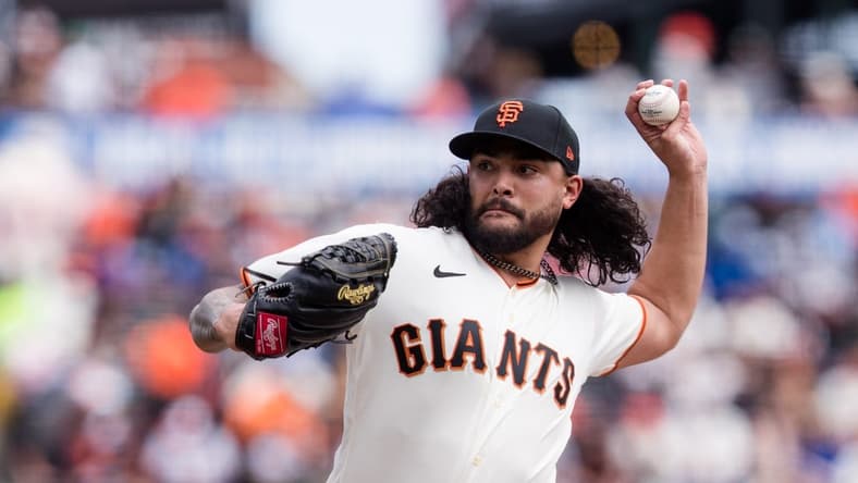 Apr 8, 2023; San Francisco, California, USA;  San Francisco Giants starting pitcher Sean Manaea (52) throws against the Kansas City Royals during the first inning at Oracle Park. Mandatory Credit: John Hefti-USA TODAY Sports