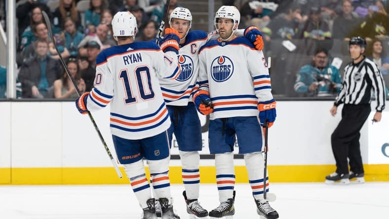 Apr 8, 2023; San Jose, California, USA; Edmonton Oilers center Derek Ryan (10) celebrates with center Connor McDavid (97) and defenseman Evan Bouchard (2) during the first period against the San Jose Sharks at SAP Center at San Jose. Mandatory Credit: Stan Szeto-USA TODAY Sports