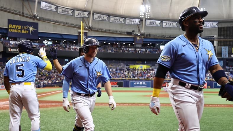 Apr 8, 2023; St. Petersburg, Florida, USA; Tampa Bay Rays second baseman Brandon Lowe (8) is congratulated after hitting a 3-run home run against the Oakland Athletics during the sixth inning at Tropicana Field. Mandatory Credit: Kim Klement-USA TODAY Sports