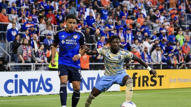 Apr 8, 2023; Cincinnati, Ohio, USA;  FC Cincinnati forward Brenner (9) passes the ball against Philadelphia Union defender Olivier Mbaizo (15) in the first half at TQL Stadium. Mandatory Credit: Aaron Doster-USA TODAY Sports