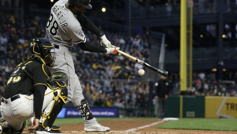 Apr 8, 2023; Pittsburgh, Pennsylvania, USA;  Chicago White Sox center fielder Luis Robert Jr. (88) hits a double down the left field line against the Pittsburgh Pirates during the fourth inning at PNC Park. Mandatory Credit: Charles LeClaire-USA TODAY Sports