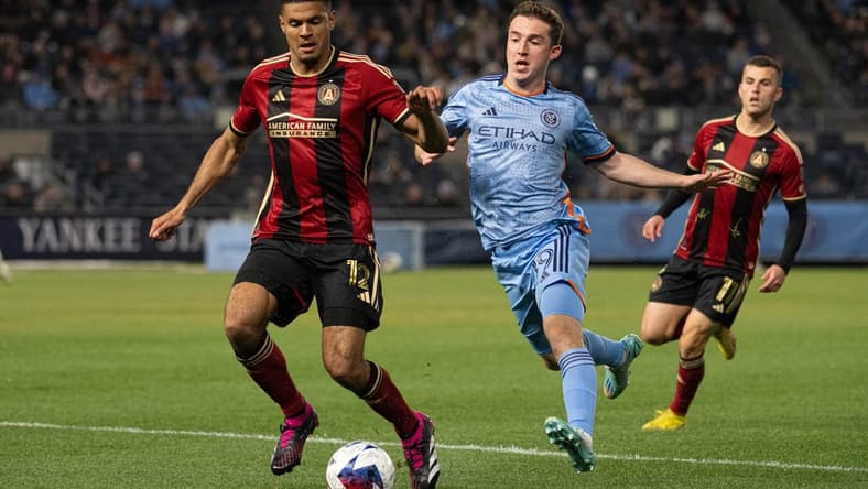Apr 8, 2023; New York, New York, USA; Atlanta United defender Miles Robinson (12) fights to control the ball against New York City FC forward Gabriel Segal (19) during the first half at Yankee Stadium. Mandatory Credit: Mark Smith-USA TODAY Sports