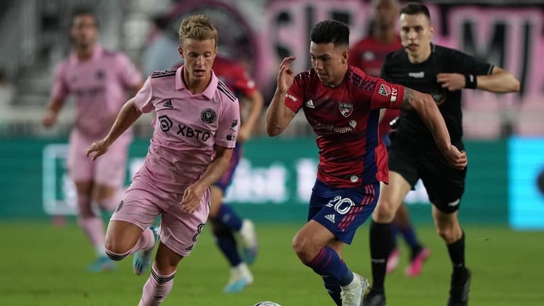 Apr 8, 2023; Fort Lauderdale, Florida, USA; FC Dallas forward Alan Velasco (20) and Inter Miami midfielder Bryce Duke (8) battle for the ball during the first half at DRV PNK Stadium. Mandatory Credit: Eric Espada-USA TODAY Sports