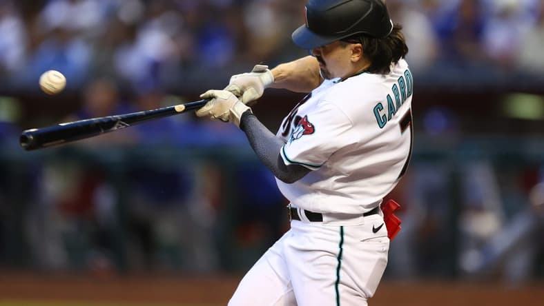 Apr 8, 2023; Phoenix, Arizona, USA; Arizona Diamondbacks outfielder Corbin Carroll hits a single in the fifth inning against the Los Angeles Dodgers at Chase Field. Mandatory Credit: Mark J. Rebilas-USA TODAY Sports