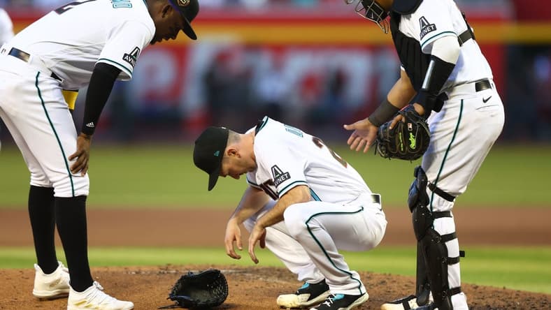 Apr 8, 2023; Phoenix, Arizona, USA; Arizona Diamondbacks pitcher Zach Davies reacts after suffering an injury in the fifth inning against the Los Angeles Dodgers at Chase Field. Mandatory Credit: Mark J. Rebilas-USA TODAY Sports
