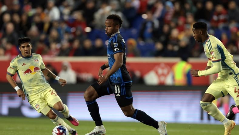 Apr 8, 2023; Harrison, New Jersey, USA;  San Jose Earthquakes forward Jeremy Ebobisse (11) controls the ball against New York Red Bulls midfielder Omir Fernandez (21) nd defender Andres Reyes (4) in the first half against the New York Red Bulls at Red Bull Arena. Mandatory Credit: Vincent Carchietta-USA TODAY Sports