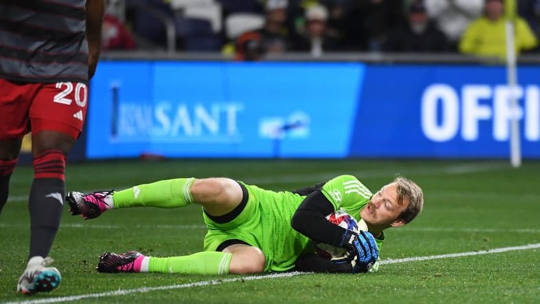 Apr 8, 2023; Nashville, Tennessee, USA; Nashville SC goalkeeper Joe Willis (1) makes a save during the second half against Toronto FC at Geodis Park. Mandatory Credit: Christopher Hanewinckel-USA TODAY Sports
