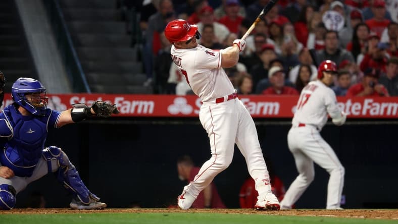 Apr 8, 2023; Anaheim, California, USA;  Los Angeles Angels center fielder Mike Trout (27) hits a 3-run home run during the fifth inning against the Toronto Blue Jays at Angel Stadium. Mandatory Credit: Kiyoshi Mio-USA TODAY Sports