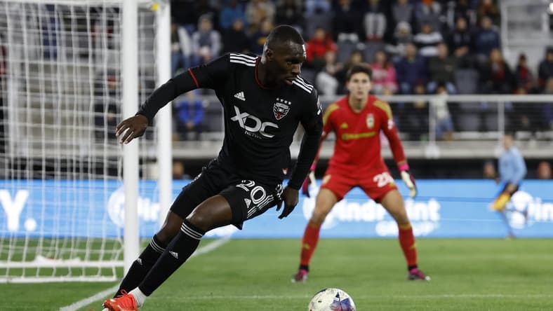 Apr 8, 2023; Washington, District of Columbia, USA; D.C. United forward Christian Benteke (20) dribbles the ball during the second half at Audi Field. Mandatory Credit: Geoff Burke-USA TODAY Sports