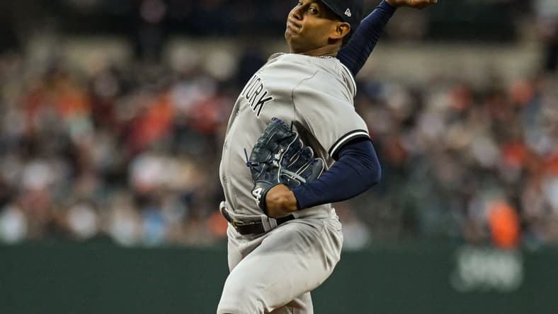 Apr 8, 2023; Baltimore, Maryland, USA;  New York Yankees starting pitcher Jhony Brito (76)  throws a first inning pitch against the Baltimore Orioles at Oriole Park at Camden Yards. Mandatory Credit: Tommy Gilligan-USA TODAY Sports