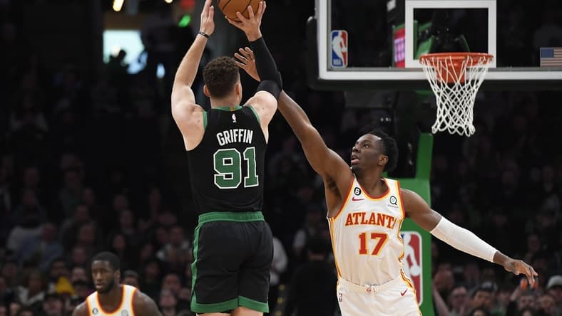 Apr 9, 2023; Boston, Massachusetts, USA; Boston Celtics forward Blake Griffin (91) shoots the ball over Atlanta Hawks forward Onyeka Okongwu (17) during the first half at TD Garden. Mandatory Credit: Bob DeChiara-USA TODAY Sports