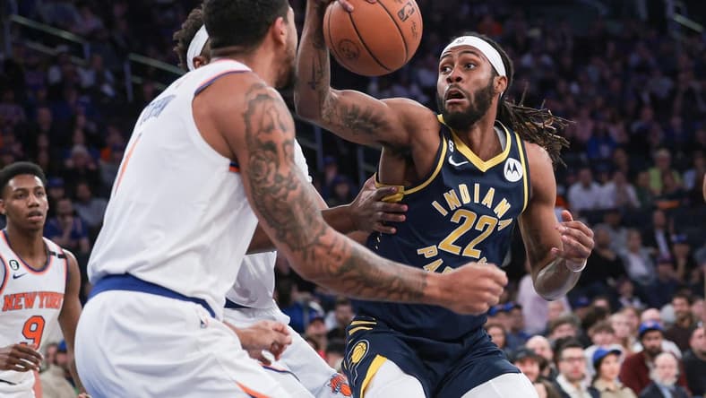 Apr 9, 2023; New York, New York, USA; Indiana Pacers forward Isaiah Jackson (22) goes ti the basket against New York Knicks center Mitchell Robinson (23) and forward Obi Toppin (1) during the first quarter at Madison Square Garden. Mandatory Credit: Vincent Carchietta-USA TODAY Sports