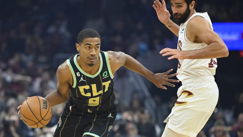 Apr 9, 2023; Cleveland, Ohio, USA; Charlotte Hornets guard Theo Maledon (9) drives beside Cleveland Cavaliers guard Ricky Rubio (13) in the first quarter at Rocket Mortgage FieldHouse. Mandatory Credit: David Richard-USA TODAY Sports