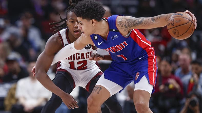 Apr 9, 2023; Chicago, Illinois, USA; Chicago Bulls guard Ayo Dosunmu (12) defends against Detroit Pistons guard Killian Hayes (7) during the first half at United Center. Mandatory Credit: Kamil Krzaczynski-USA TODAY Sports