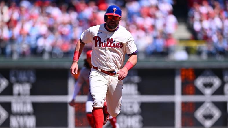 Apr 9, 2023; Philadelphia, Pennsylvania, USA; Philadelphia Phillies outfielder Kyle Schwarber (12) advances toward third to score against the Cincinnati Reds in the first inning at Citizens Bank Park. Mandatory Credit: Kyle Ross-USA TODAY Sports