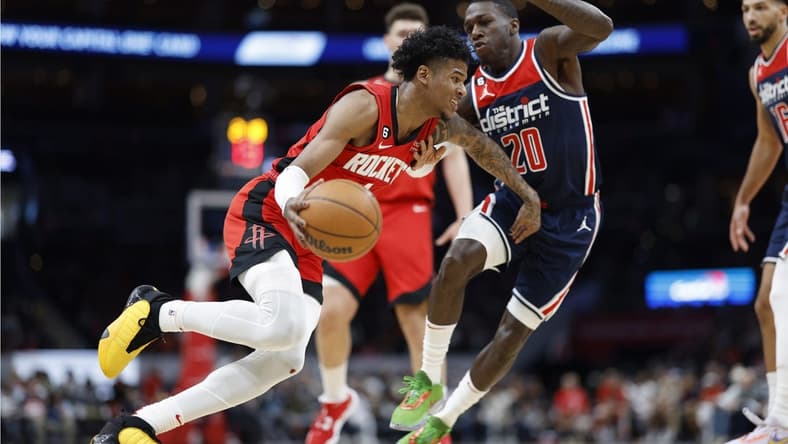 Apr 9, 2023; Washington, District of Columbia, USA; Houston Rockets guard Jalen Green (4) dribbles the ball as Washington Wizards guard Kendrick Nunn (20) defends in the second quarterat Capital One Arena. Mandatory Credit: Geoff Burke-USA TODAY Sports